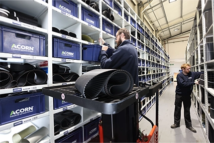 Acorn operatives picking timing belt sleeves for slicing into timing belts